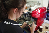 Student barista at work making coffee